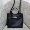 Niche Design Lock Buckle Leather Bucket Bag Pebble Pattern Top Layer Cowhide Large Capacity Portable Commuter Shoulder Bag