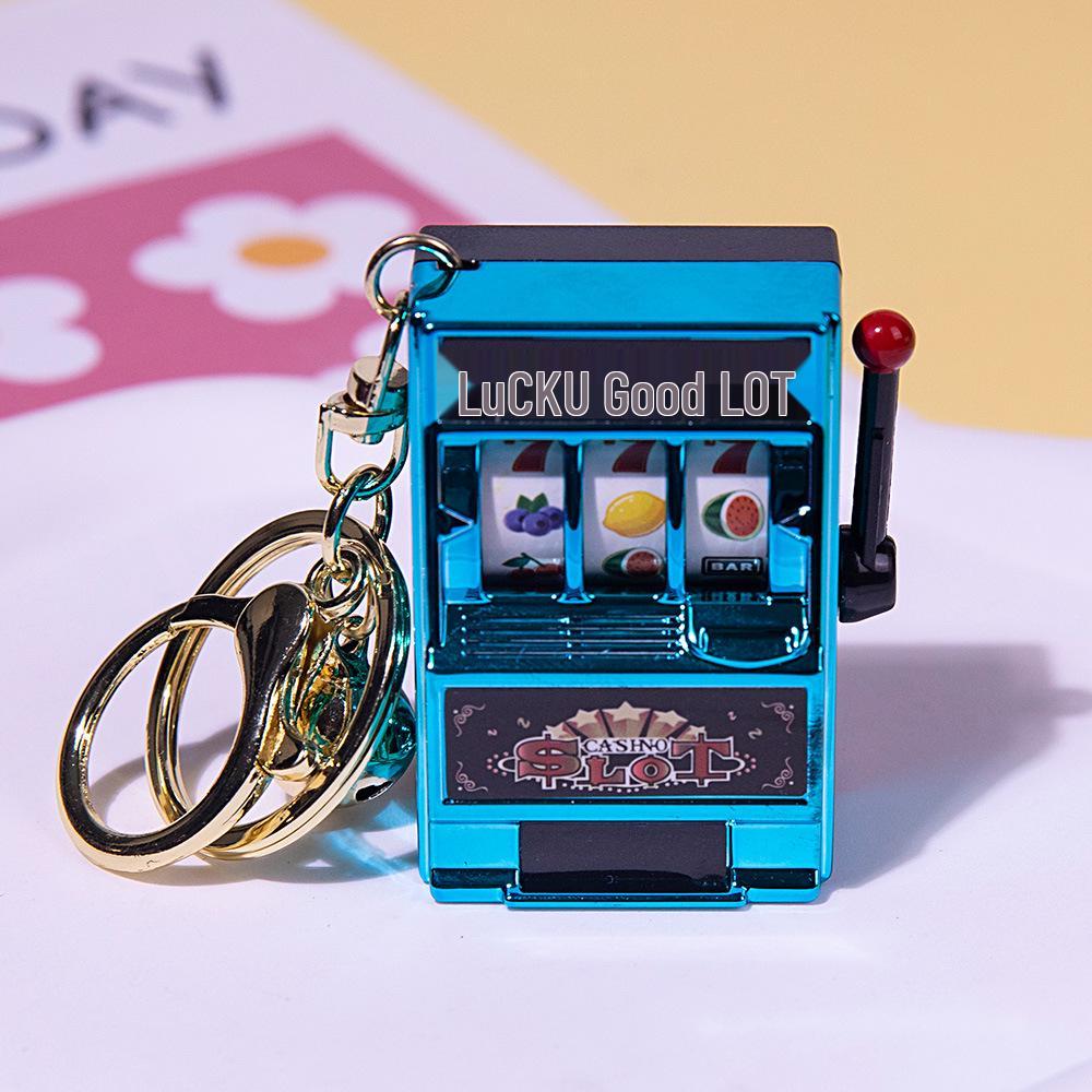 

Gold-Plated Creative Tiger Fruit Machine Keychain Toy with Lottery Play Feature