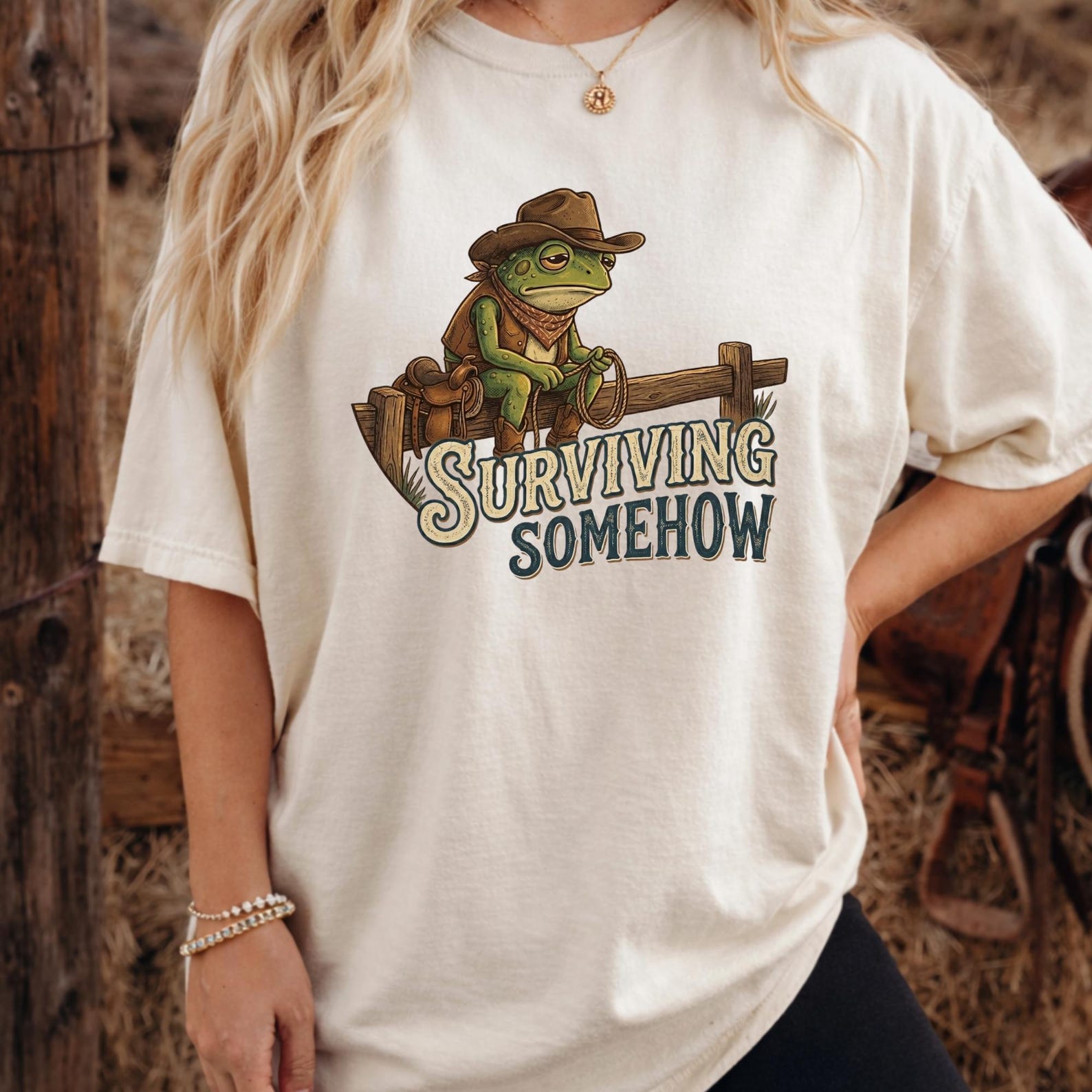 Surviving Somehow Frog Shirt, Funny Cowboy Frog T-Shirt, Sad Toad Graphic Tee, Western Cottagecore Aesthetic, Country Froggy Meme Tshirt. L