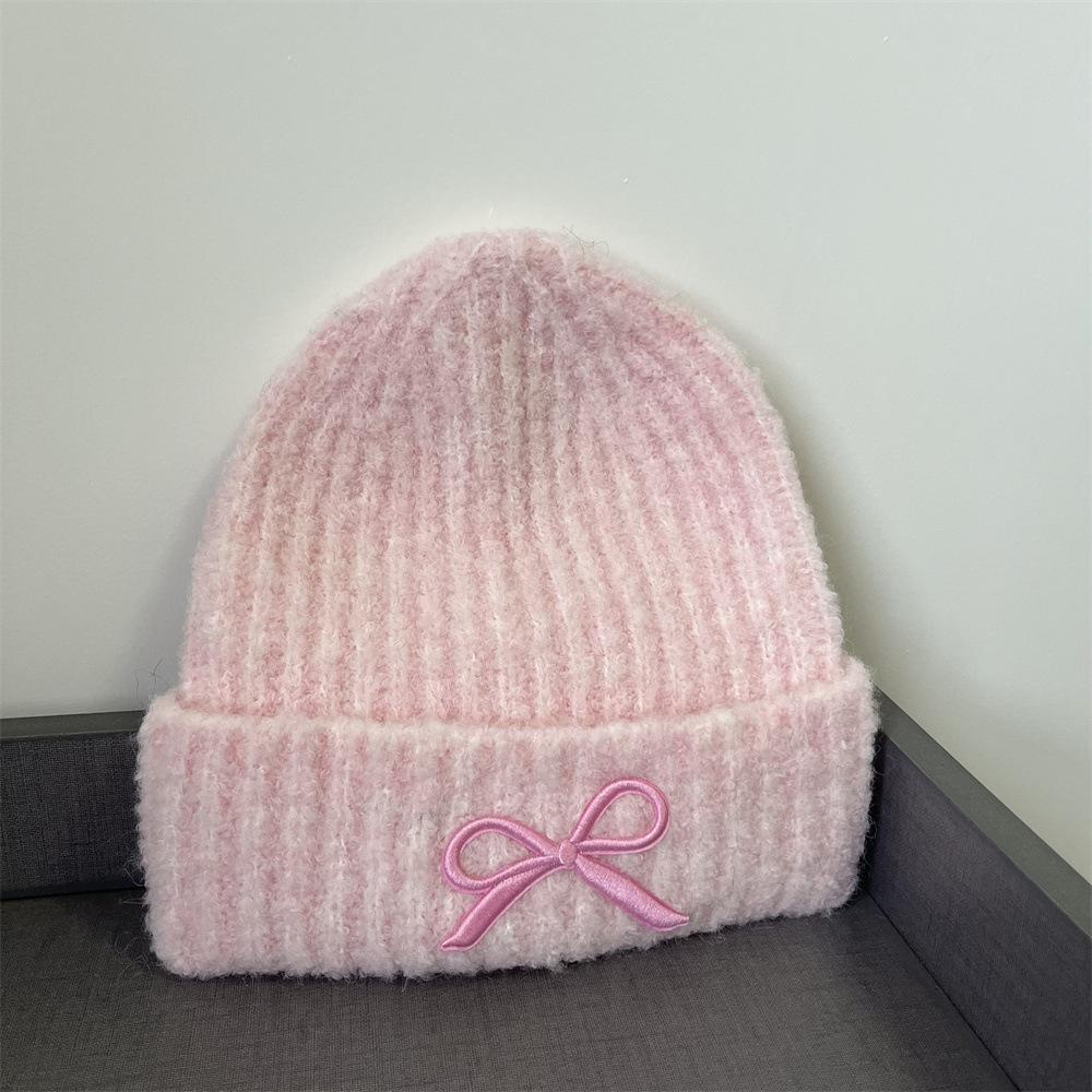 Hat women's autumn and winter wool hat new cute bow versatile cold hat ear protection warm knitted hat tide