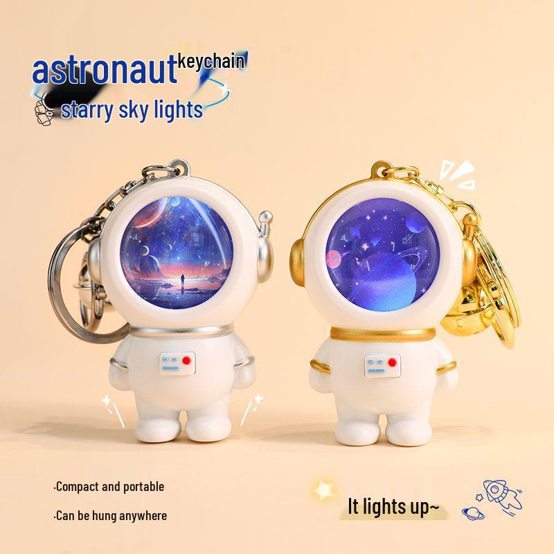 Creative Astronaut Starry Sky Keychain Pendant: Cartoon Doll Schoolbag Decoration, Perfect for Students or Couples.