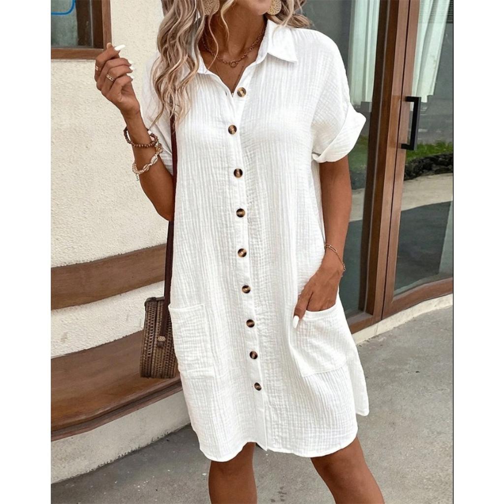 A Simple White Shirt Skirt, Made of Breathable Cotton, with A Streamlined Collar Design and Orderly Button Arrangement, Adding A Vintage Charm