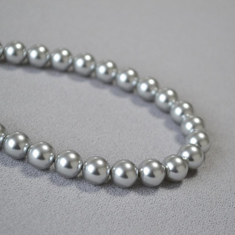 

Ожерелье из искусственной пеньки с кристаллами и жемчугом «French Moonlight» и серебристо-серым узором