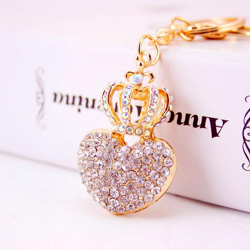 Elegant Diamond-Studded Four-Leaf Clover Keychain: Perfume Bottle Bag Charm for Women