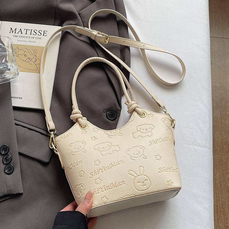 2025 new casual niche cute print high-end portable bucket bag fashionable women's commuter style messenger bag