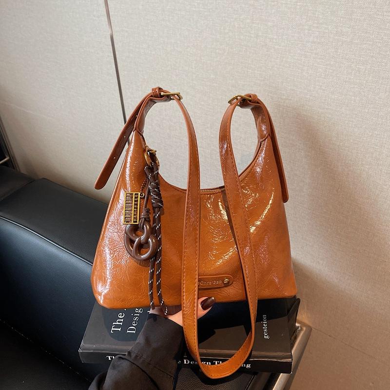 

Retro Simple Armpit Commuter Bag Women s 2025 New Simple Bucket Bag Versatile One Shoulder Crossbody Bag коричневий