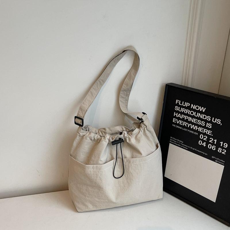 New Summer Large Capacity Drawstring Bucket Bag for Women Japanese Casual Crossbody Bag Street Shoulder Commuting Bag