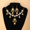 Bohemian Vintage Two - Piece Jewelry Set: Necklace and Earrings with Tassel Geometric Design