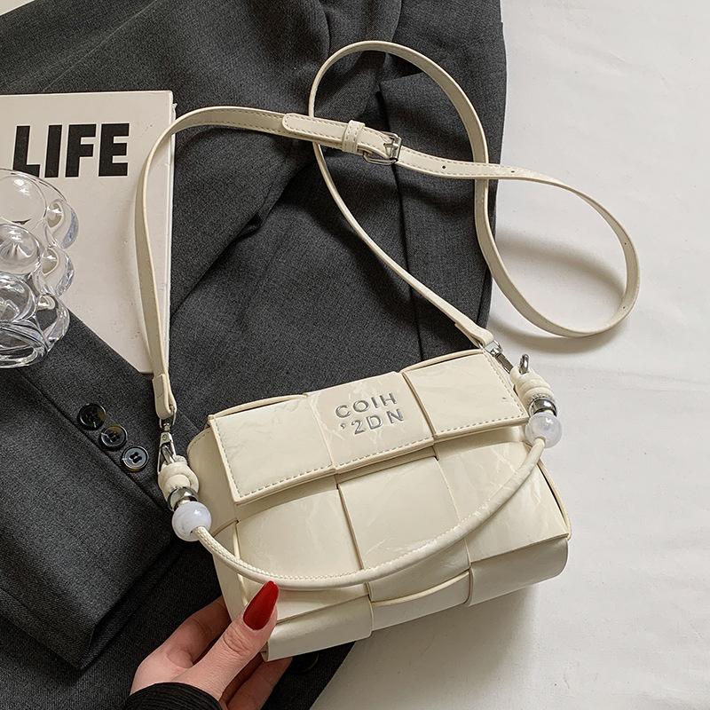 Spring and summer hot sale versatile high-end woven grid portable small square bag Korean version casual fashion commuter messenger women's bag