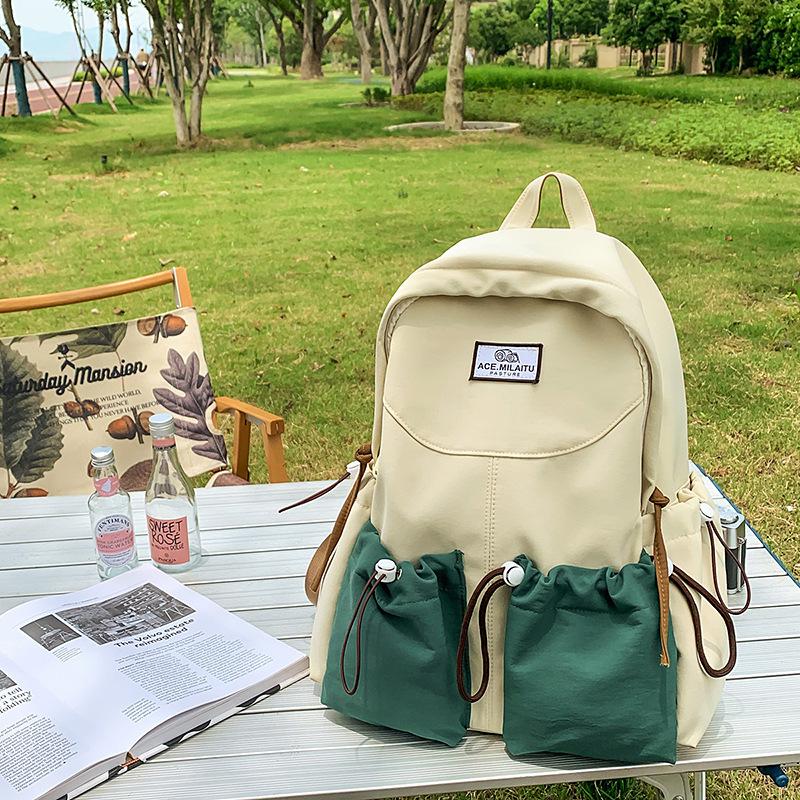 New high-value college-style men's and women's schoolbags, Korean version school students, contrasting colors, casual commuting, versatile backpack.