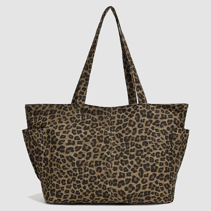 

2025 autumn and winter new canvas bag large capacity tote bag cartoon plaid college style double-sided shoulder bag commuter bag леопард друку кольору