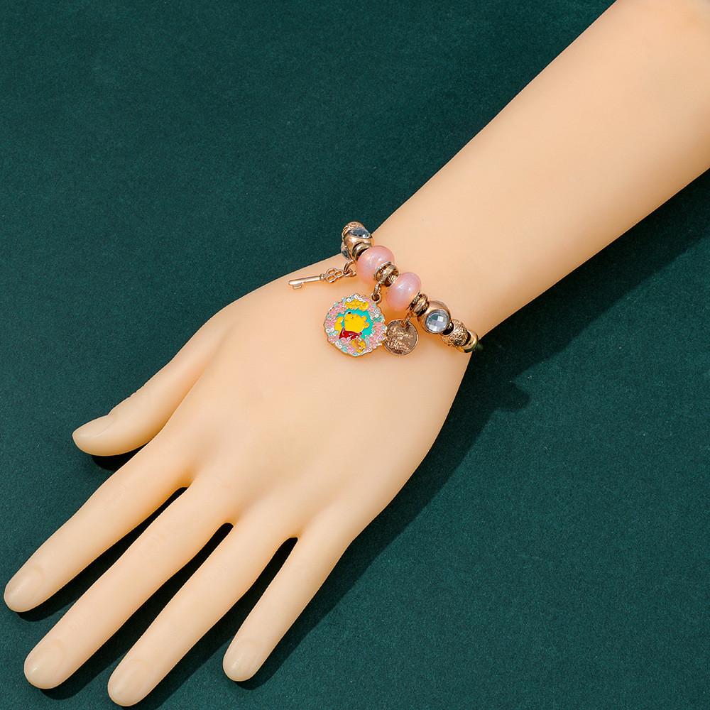 Winnie Puuh Handkette für Damen und Teenager mit goldenen Zinklegierungsperlen und Cartoon-Design