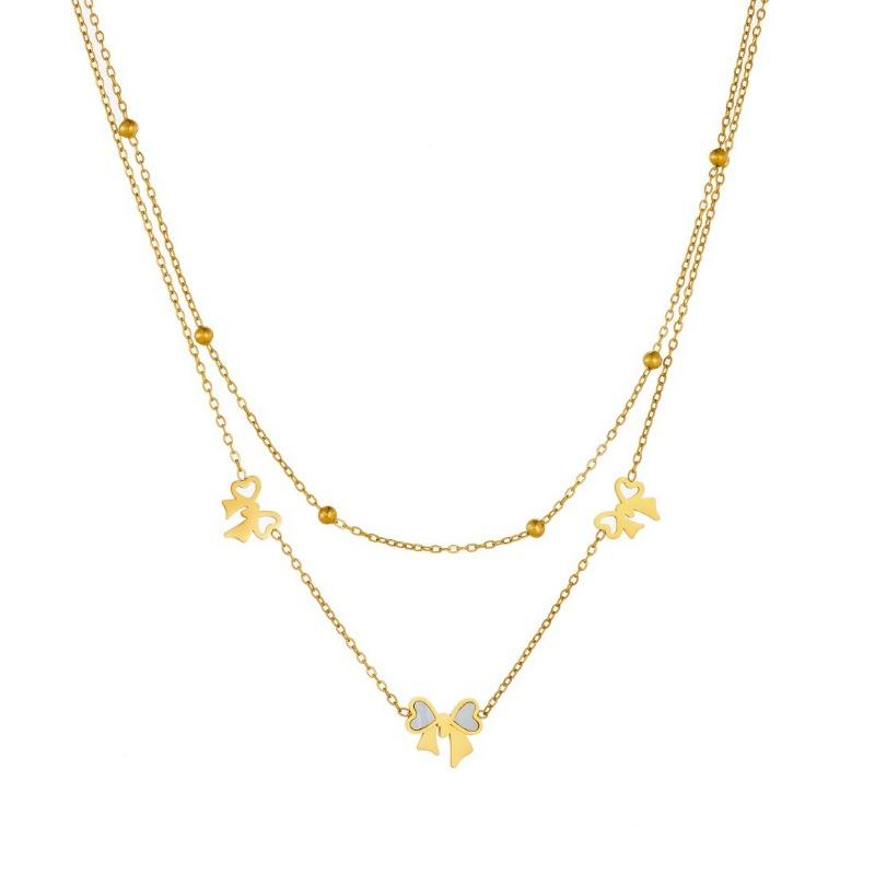 Gold Bow Charm Jewelry Set: Necklace and Bracelet with White Enamel Accents