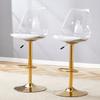 Modernes Barhocker-Set mit transparenten Kunststoffrückenlehnen und Sitzflächen aus PU-Leder, goldfarbene Metallbeine. Höhenverstellbar und 360 Grad drehbar.