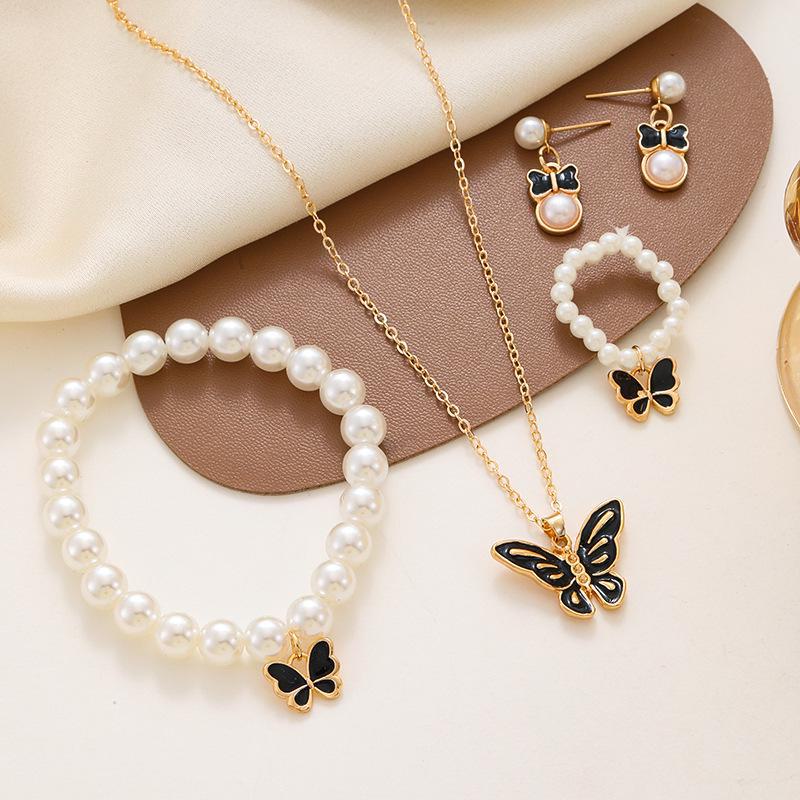 Charming Pearl Butterfly Jewelry Set: Necklace, Earrings, Ring & Bracelet