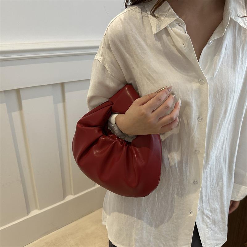 Unique niche design bag, new women's bag, popular in summer, versatile handbag, portable wrist bag