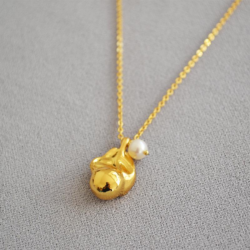 

Baroque Style Gilded Brass Freshwater Pearl Pendant Necklace