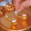 Korean version champagne pearl earrings, snowflake earrings, long temperament, high-end light luxury earrings, earrings.