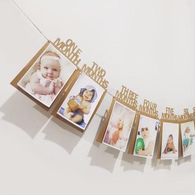 Foto-Girlande zum 1. Geburtstag des Babys: Kraftpapier-Girlande für die 100-Tage-Feier