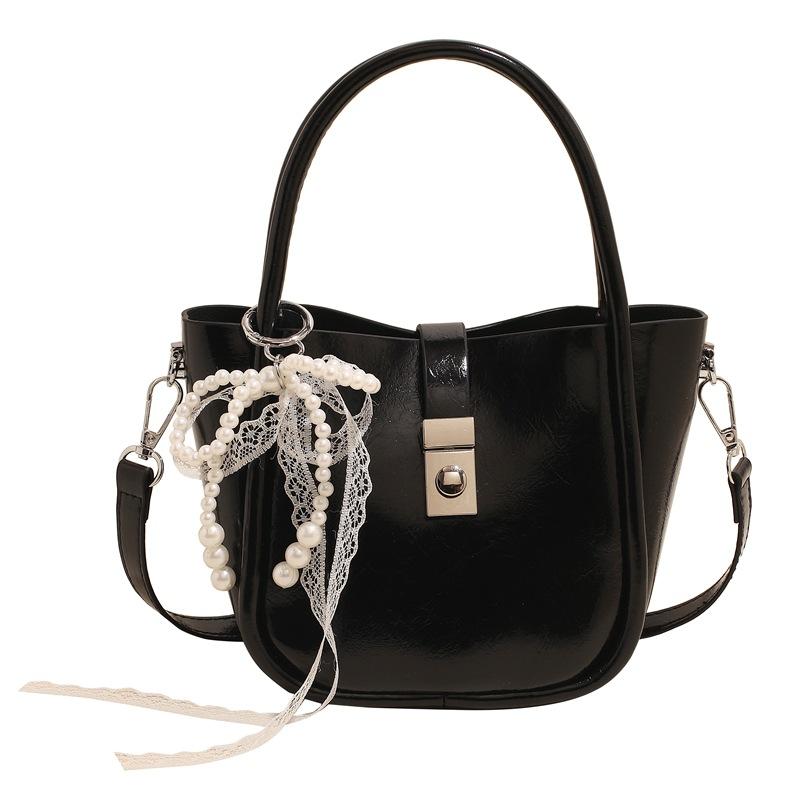 Spring and Summer New Casual Simple High-end Oil Wax Leather Portable Bucket Bag Korean Version Niche Design Solid Color Messenger Bag