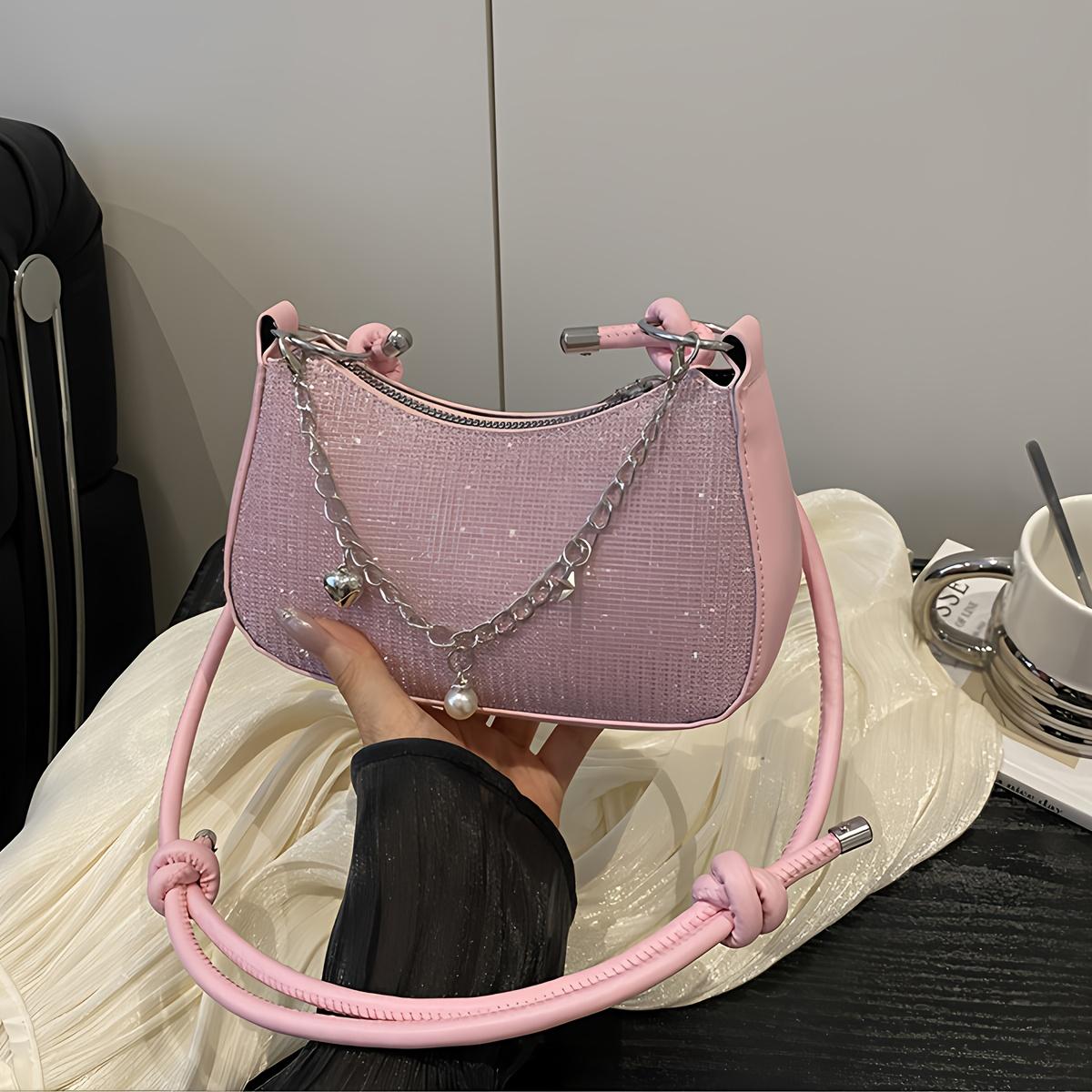 This compact shoulder bag with a sparkly chain strap is perfect for daily commutes, outings, work, and travel. Average Size