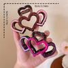 One elegant heart-shaped hairpin, a half-tied hairpin, a stylish hairpin, and a shark clip at the back of the head