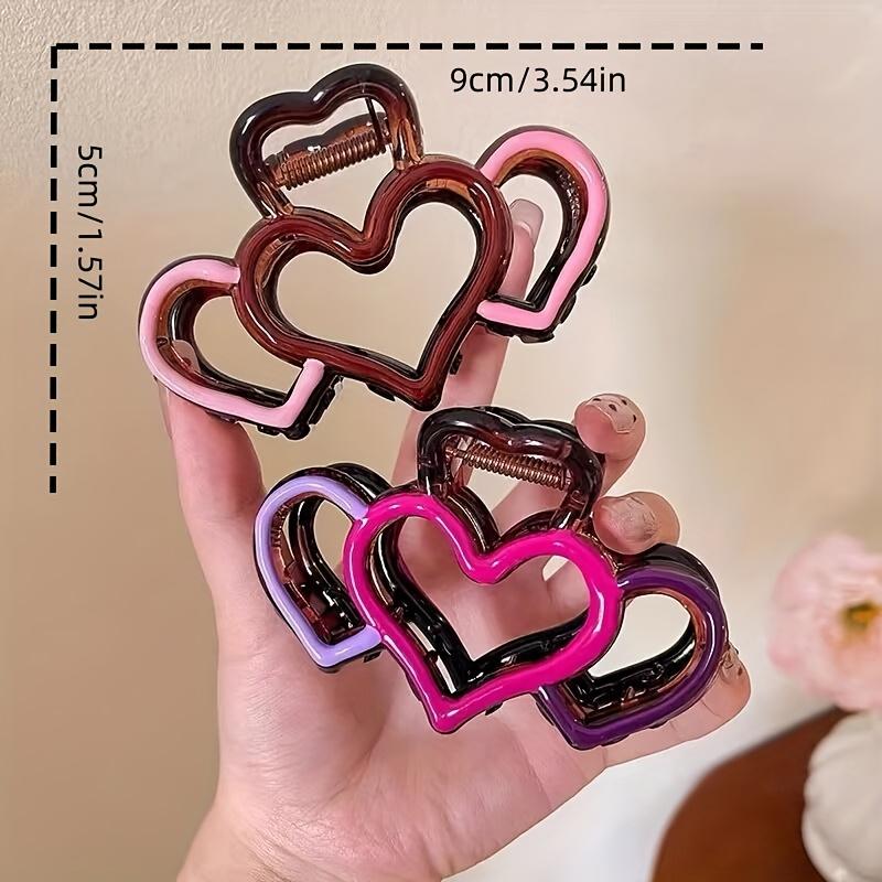 One elegant heart-shaped hairpin, a half-tied hairpin, a stylish hairpin, and a shark clip at the back of the head