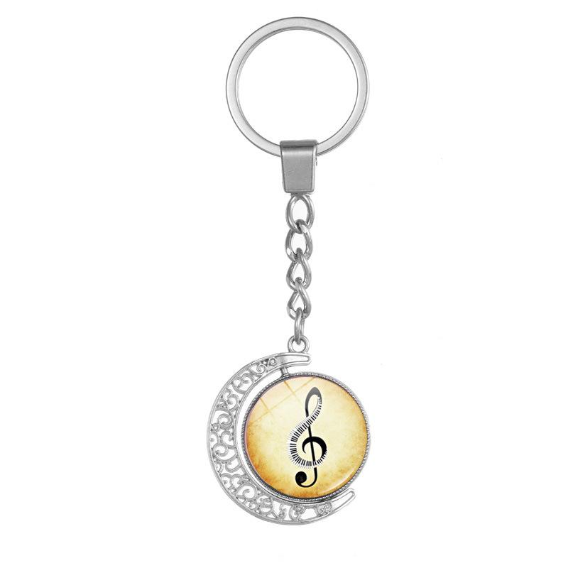 Heart-Shaped Rotating Piano Key Pendant Keychain with Gem and Musical Notes Ornament
