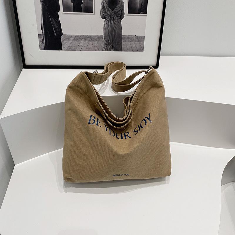 

Модний дизайн текстура популярна сумка сумка під пахвами жіноча 2024 нова полотняна французька нішева портативна коса жіноча сумка хакі