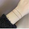 Zweireihiges Titanstahl Goldbeschichtet Perlenarmband