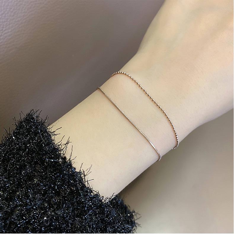 Zweireihiges Titanstahl Goldbeschichtet Perlenarmband