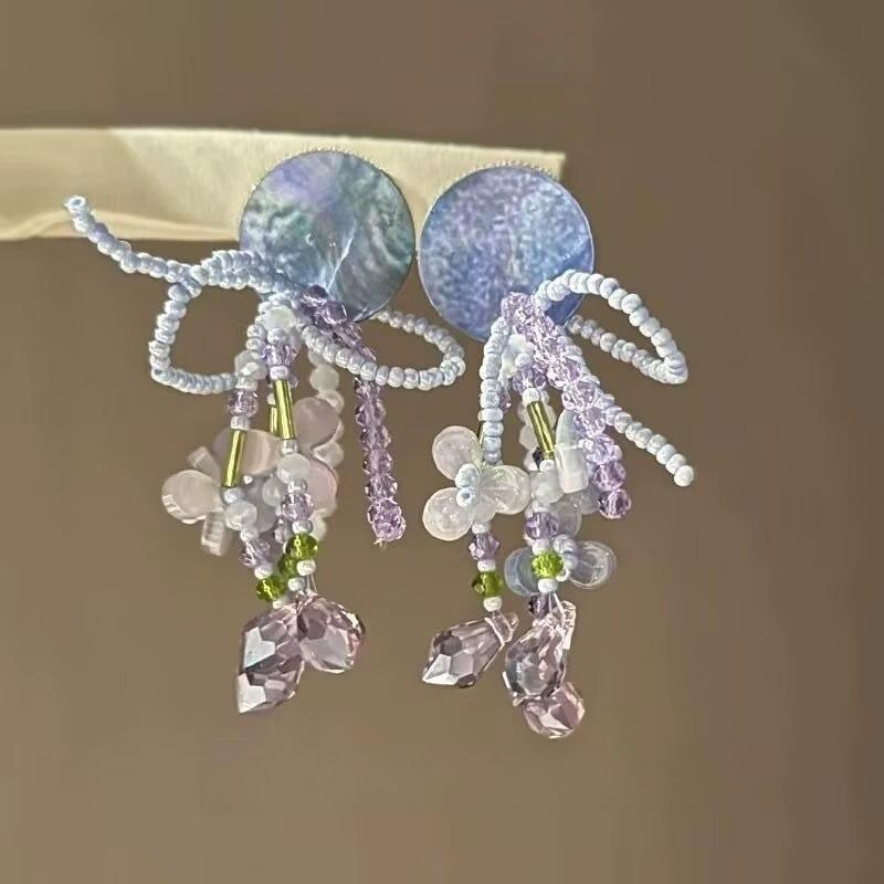

Rice beads beaded flower round earrings women s fresh and fashionable stud earrings high-end commuting versatile earrings