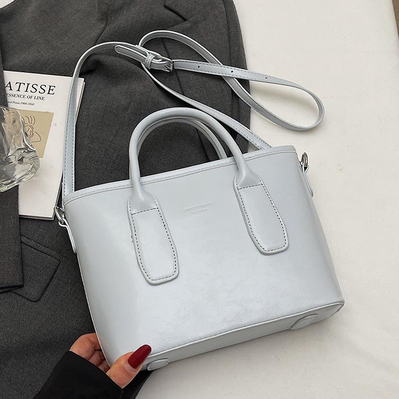 

Новая высококлассная корейская версия Hugh простая портативная сумка-ведро универсальная модная нишевая сумка-мессенджер для通勤 сумка женская