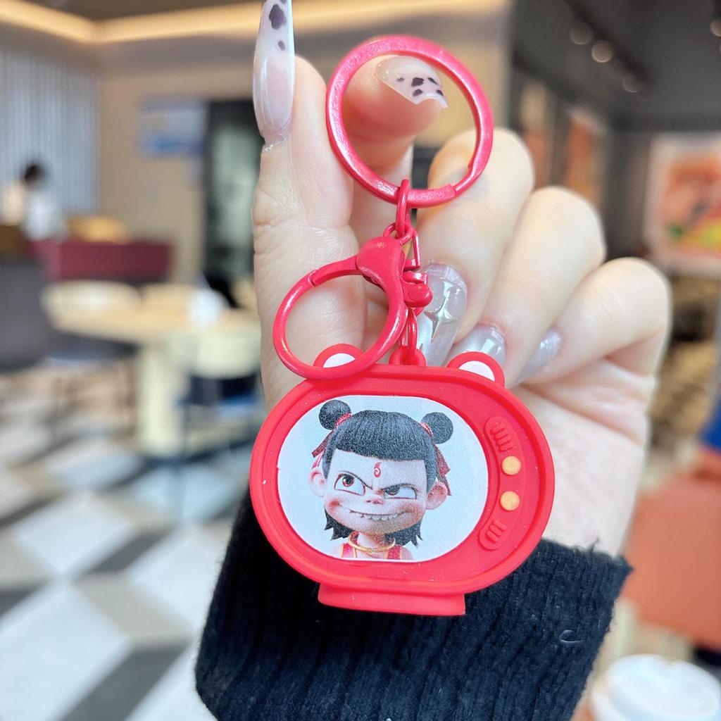Nezha Luminous TV Keychain with Light - Student Backpack Pendant Ornament.