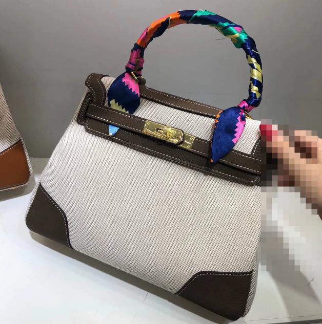 

2024 New canvas platinum bag first layer lychee pattern cowhide single shoulder diagonal span portable genuine leather women s bag 27x14x22cm