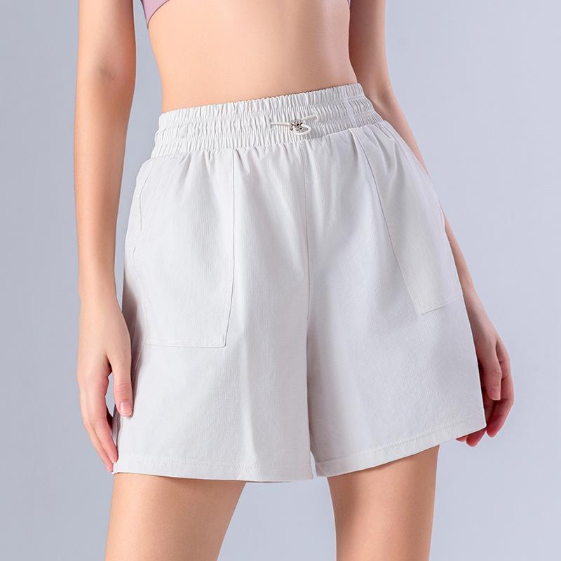 Quick-Dry Women's Summer Sports Shorts – Cool, Breathable, Loose Fit with Side Pockets for Running and Pilates.