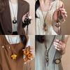 New Chinese leather pendant, fringed necklace, female ethnic style, niche retro sweater chain, fashion and high-end item jewelry.