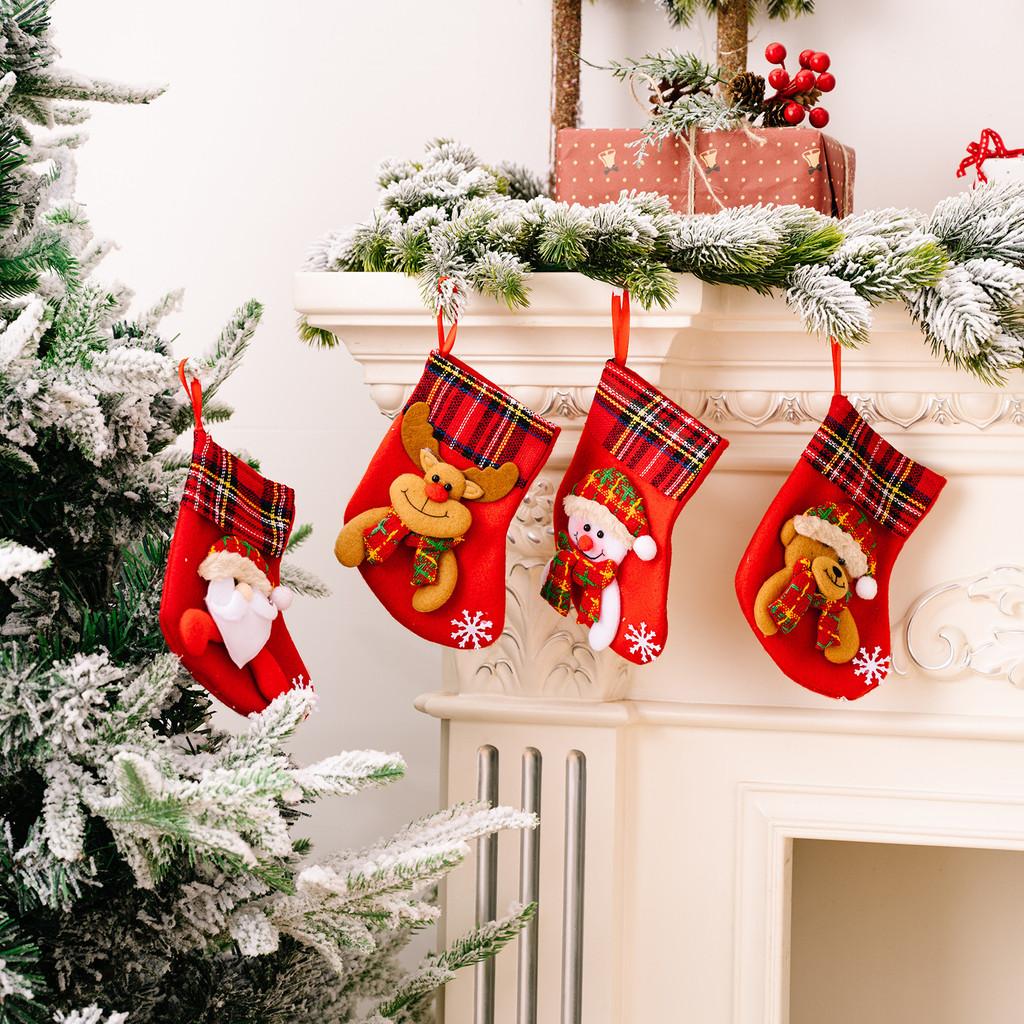 Decorative Red Christmas Stockings With Fun Cartoon Designs Of Santa Snowman Reindeer Bear For Vibrant Celebrations Festive