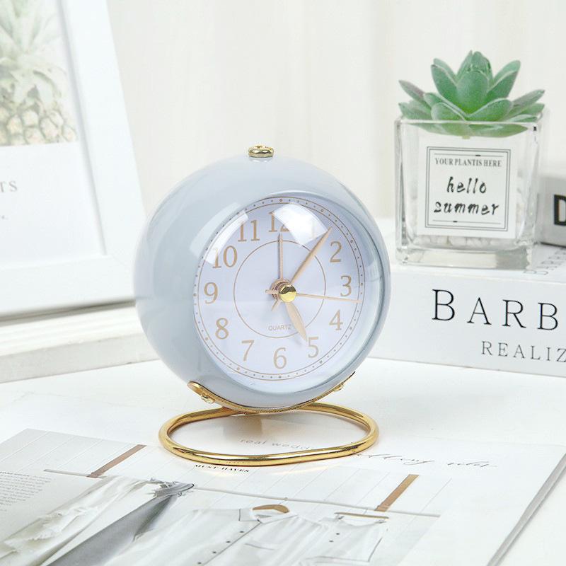 Silent Metal Alarm Clock with Night Light and Gold Stamped Spherical Face - Perfect for Students and Children.