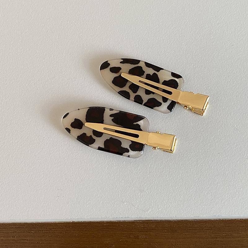 Korean version of retro fashionable leopard print seamless oval hairpin personalized versatile makeup edge clip hair accessories