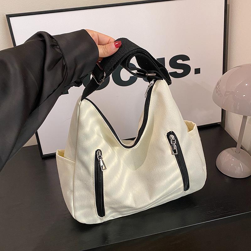 New simple trend Korean version messenger bag women's shopping with change bag niche design shoulder women's bag