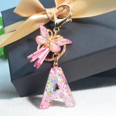 Neue rosa Schmetterlings-Pailletten mit englischen Initialen, Schmetterlingsquaste, Schlüsselanhänger für Damentasche, Studentenrucksack, Schlüsselanhänger
