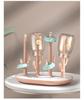 Versatile Baby Bottle Holder & Detachable Drying Rack with Pacifier Slot.