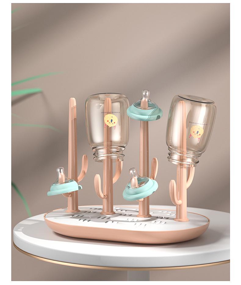 Versatile Baby Bottle Holder & Detachable Drying Rack with Pacifier Slot.