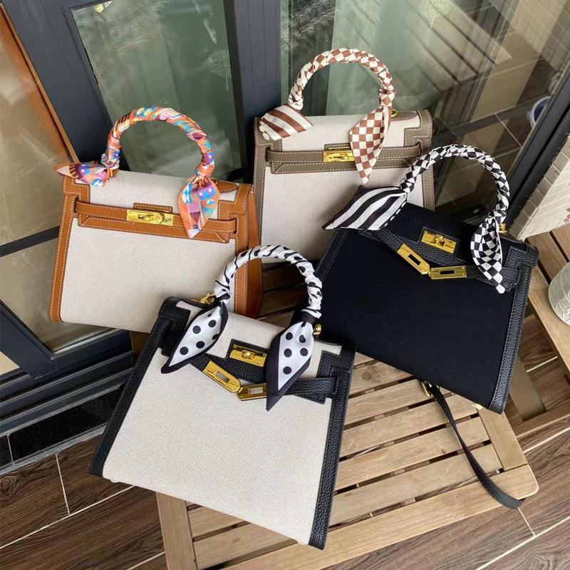 New temperament messenger bag women's canvas with leather bag contrasting color leather handbag fashion lock shoulder bag