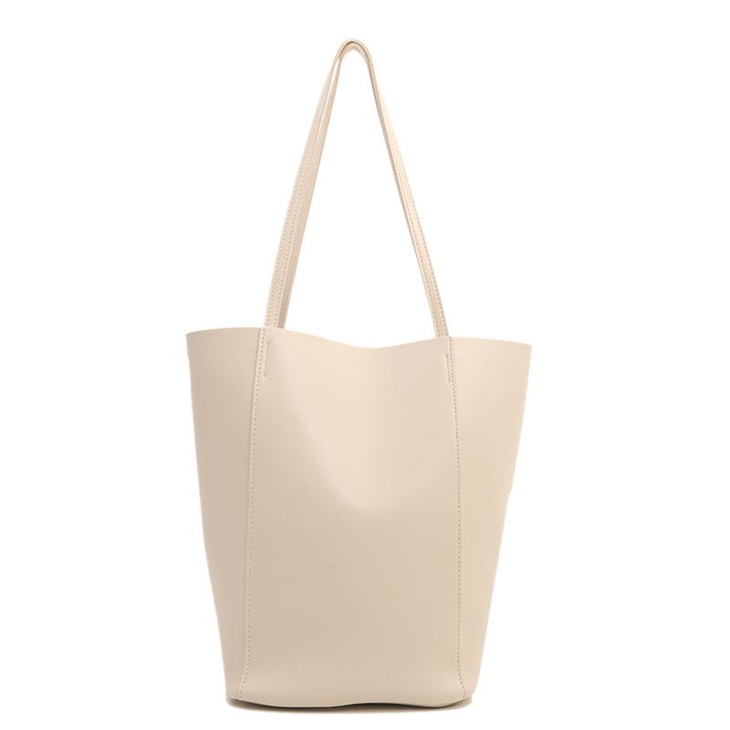 

Новые кожаные женские сумки осень и зима нишевые высококлассные вместительные сумки-тоут для通勤 женские сумки-ведра на плечо белый