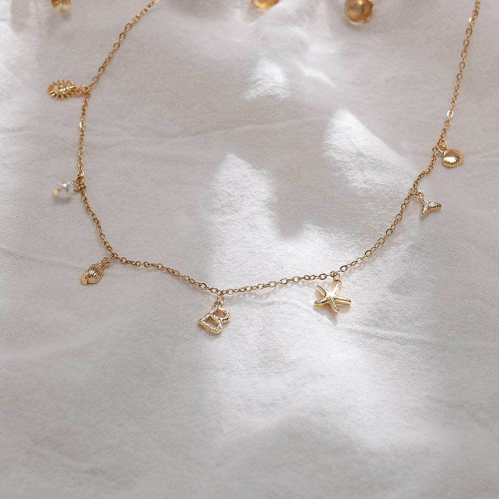 Einfache und modische Goldbuchstaben-Serie Meereskreaturen-Dekorationskette