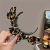 A Leopard Print Hair Clip Made of Plastic, Plasticfor Women, Featuring A Non-Feather Design Suitable for Various Hairstyles