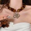 Amber Flower Acrylic Jewelry Set: Retro Maillard Clavicle Chain with Necklace, Earrings, and Bracelet for Women - Luxurious and Elegant Feel.