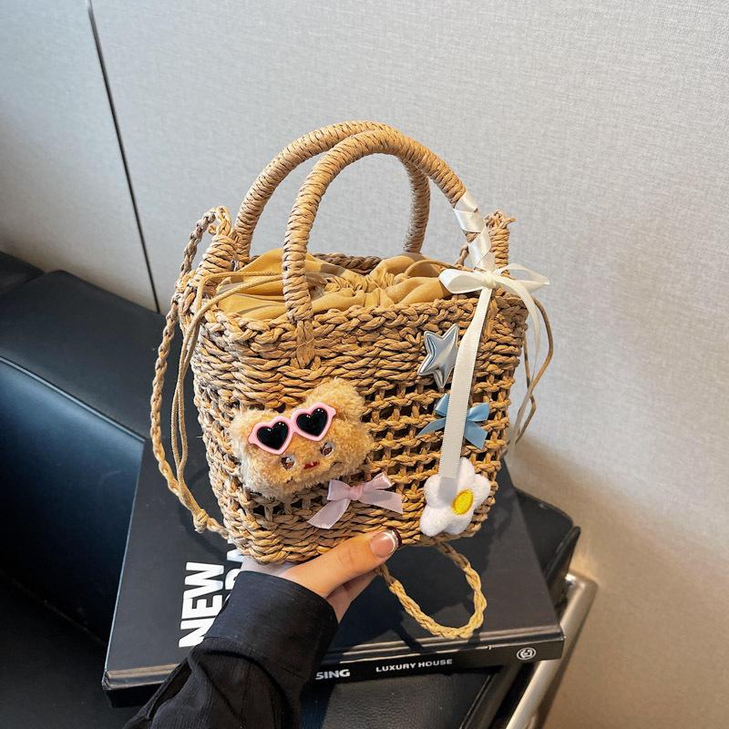 

Bucket bag women s new woven handbag shoulder messenger bag beach vacation straw bag tide коричневий